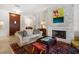 Cozy living room featuring a stone fireplace, comfortable seating, and a stylish decor at 514 Riviera Dr, Tampa, FL 33606