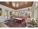 Inviting living room with coffered ceilings, unique window trim and a large oriental rug with bright sofas at 514 Riviera Dr, Tampa, FL 33606