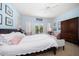 Inviting bedroom with balcony, plantation shutters, and comfortable furnishings at 514 Riviera Dr, Tampa, FL 33606