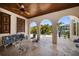 Inviting outdoor patio featuring arched openings with views of the pool and waterfront at 514 Riviera Dr, Tampa, FL 33606