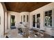Charming outdoor patio with tiled floor, ample seating, and access to both the interior and exterior spaces at 514 Riviera Dr, Tampa, FL 33606