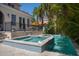 Elegant pool and spa with decorative tile and easy access to the home's patio and outdoor living spaces at 514 Riviera Dr, Tampa, FL 33606