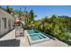 Beautiful pool and spa with manicured landscaping and lush tropical trees at 514 Riviera Dr, Tampa, FL 33606