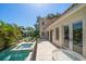 Stunning waterfront backyard featuring a pool, spa, and patio area perfect for entertaining at 514 Riviera Dr, Tampa, FL 33606