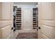 Organized walk-in closet with extensive shelving for shoes and clothing storage at 514 Riviera Dr, Tampa, FL 33606