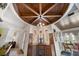 Stylish wet bar featuring custom wood ceiling details, a beverage cooler, and unique architectural millwork at 514 Riviera Dr, Tampa, FL 33606
