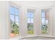 A corner section of a home featuring bay windows providing beautiful natural light and views of the outside landscape at 514 Riviera Dr, Tampa, FL 33606