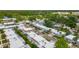 An aerial view showcases a well-planned residential area with lush greenery and community pools at 602 Mindy Dr, Largo, FL 33771