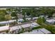 An aerial shot of a residential community with a mix of tree coverage and nearby amenities at 602 Mindy Dr, Largo, FL 33771
