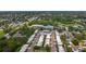 An aerial view of a neighborhood, close to both a baseball field, a water park, and a lake at 602 Mindy Dr, Largo, FL 33771