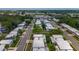 An aerial view of a quiet residential neighborhood with mature trees and well-kept homes at 602 Mindy Dr, Largo, FL 33771