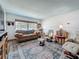 Cozy living area with stylish furniture, a textured rug, and plenty of natural light at 602 Mindy Dr, Largo, FL 33771
