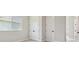 Bright bedroom featuring a double closet, and a large window at 6126 Hidden Branch Dr, Apollo Beach, FL 33572
