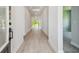 Inviting entryway featuring wood-look floors and plenty of natural light creates a warm atmosphere at 6126 Hidden Branch Dr, Apollo Beach, FL 33572