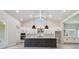 Modern kitchen with a large island, pendant lighting, stainless steel appliances and ample storage at 6126 Hidden Branch Dr, Apollo Beach, FL 33572