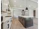 Bright kitchen with an island, light countertops, stainless appliances, and lots of space for cooking at 6126 Hidden Branch Dr, Apollo Beach, FL 33572