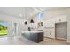 Spacious kitchen featuring a large island, stainless steel appliances and an open floor plan at 6126 Hidden Branch Dr, Apollo Beach, FL 33572
