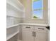 Pantry featuring ample shelving and storage space at 6126 Hidden Branch Dr, Apollo Beach, FL 33572