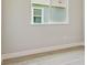 Neutral room features light walls, ample natural light, and light-colored flooring at 6126 Hidden Branch Dr, Apollo Beach, FL 33572