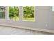 Well-lit interior with light-colored flooring and windows offering outdoor views at 6126 Hidden Branch Dr, Apollo Beach, FL 33572