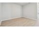 Clean and modern, the room features light-colored flooring, light walls, and a minimalist aesthetic at 6126 Hidden Branch Dr, Apollo Beach, FL 33572