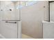 Modern tiled shower featuring a frameless glass enclosure and rainfall shower head at 6126 Hidden Branch Dr, Apollo Beach, FL 33572