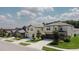 Aerial view of a neighborhood with lush trees and homes, showcasing the residential community at 6444 Bar S Bar Trl, Zephyrhills, FL 33541