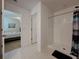 Bright bathroom featuring a walk-in shower with white tile surround and chrome fixtures at 6444 Bar S Bar Trl, Zephyrhills, FL 33541
