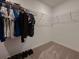 Walk-in closet with wire shelving and hanging rods for ample clothing storage at 6444 Bar S Bar Trl, Zephyrhills, FL 33541