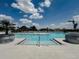 Step into the community pool with shallow entry and enjoy the clear water and scenic views at 6444 Bar S Bar Trl, Zephyrhills, FL 33541