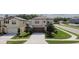 Charming two-story home featuring a two car garage, beautiful trees, and luscious landscaping at 6444 Bar S Bar Trl, Zephyrhills, FL 33541