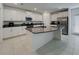 Modern kitchen features granite countertops, stainless steel appliances, and ample cabinet space at 6444 Bar S Bar Trl, Zephyrhills, FL 33541