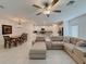 Open-concept living space connecting a modern kitchen, dining area, and comfortable living room at 6444 Bar S Bar Trl, Zephyrhills, FL 33541