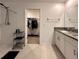 Main bathroom featuring a walk-in shower, dual sink vanity and an adjacent walk-in closet at 6444 Bar S Bar Trl, Zephyrhills, FL 33541