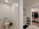 Main bathroom with a walk-in shower and an adjacent walk-in closet with clothing racks at 6444 Bar S Bar Trl, Zephyrhills, FL 33541