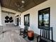 Inviting patio area with rocking chairs and stylish decor, perfect for relaxing outdoors at 6444 Bar S Bar Trl, Zephyrhills, FL 33541