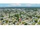 An aerial image of a neighborhood, showcasing the property's location amidst houses and greenery in a residential area at 6875 11Th N Ave, St Petersburg, FL 33710