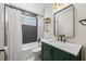 Stylish bathroom boasts modern fixtures, a tub with shower, and elegant tile accents at 6875 11Th N Ave, St Petersburg, FL 33710