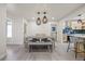Dining room features an open concept with updated hanging lights and breakfast bar at 6875 11Th N Ave, St Petersburg, FL 33710