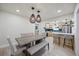 Open concept dining room with pendant lighting features access to the kitchen at 6875 11Th N Ave, St Petersburg, FL 33710