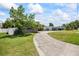 Well maintained driveway and landscaping complement this home at 6875 11Th N Ave, St Petersburg, FL 33710