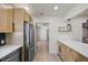 Light-filled kitchen with stainless steel appliances and seamless open floorplan at 6875 11Th N Ave, St Petersburg, FL 33710