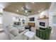 Comfortable living room featuring a fireplace and an open floorplan at 6875 11Th N Ave, St Petersburg, FL 33710