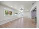 Spacious living room with modern floors, large windows, and an open floorplan at 6875 11Th N Ave, St Petersburg, FL 33710