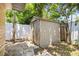Backyard shed surrounded by green foliage at 6875 11Th N Ave, St Petersburg, FL 33710