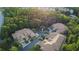 Aerial view of a private community surrounded by lush, mature trees at 7246 Gaberia Rd, New Port Richey, FL 34655
