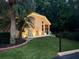 Beautiful backyard with a patio, lawn, and mature trees, perfect for outdoor living at 7246 Gaberia Rd, New Port Richey, FL 34655