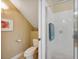 Clean bathroom includes a walk-in shower, tiled walls, and a toilet in a separate nook at 7246 Gaberia Rd, New Port Richey, FL 34655