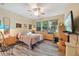 Bedroom with a ceiling fan, natural light, and a cozy layout at 7246 Gaberia Rd, New Port Richey, FL 34655