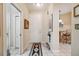Welcoming entryway with neutral decor, tile flooring, and decorative accents, and access to the kitchen at 7246 Gaberia Rd, New Port Richey, FL 34655